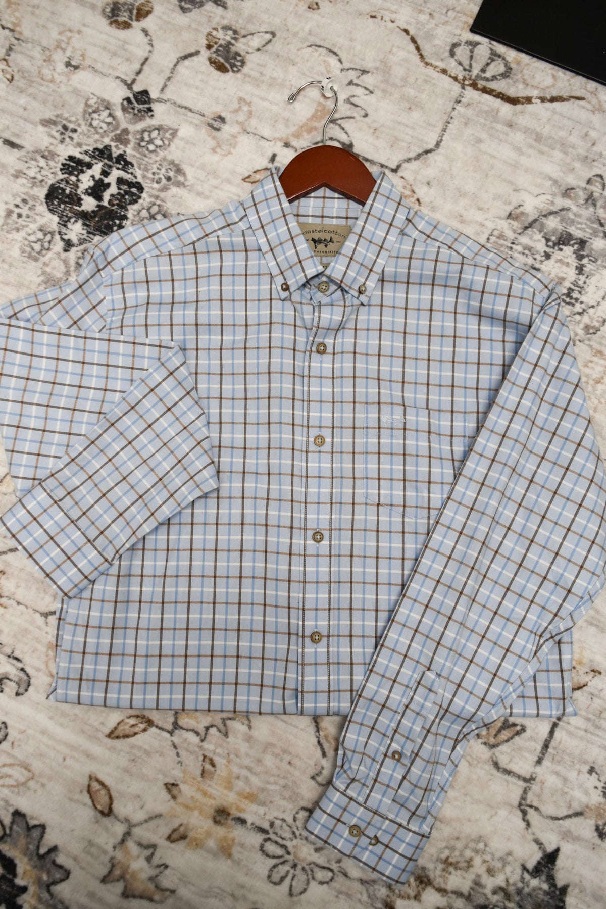 Coastal Cotton long-sleeve button-down shirt in light bay blue plaid check pattern on hanger
