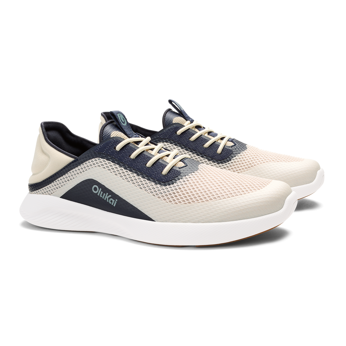 OluKai Men's Kialoa sneaker in Tapa cream and Trench Blue navy colorway with white sole