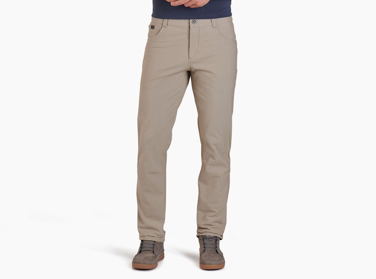Kuhl Resistor Chino Pant in khaki worn by male model with casual shoes