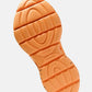 Kane Revive shoe outsole in electric orange with black speckle detailing and wave tread pattern