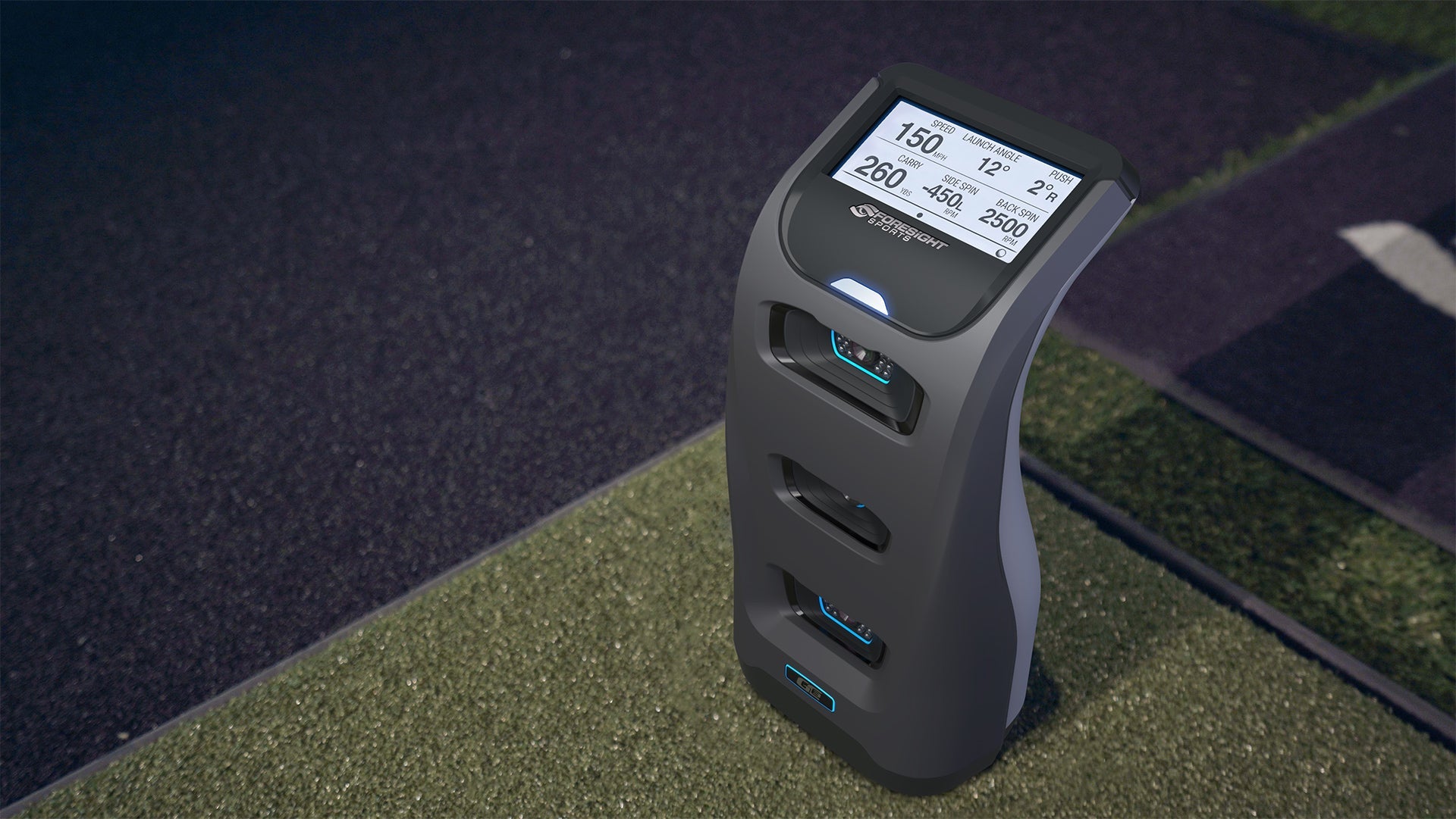 Foresight Sports QC3 launch monitor displaying ball speed, carry distance, spin data on golf mat