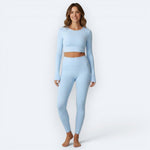 Mercifully Made long-sleeve crop top in sky blue paired with matching high-waist leggings