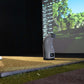 Foresight QC3 launch monitor on golf mat beside player in indoor simulator bay