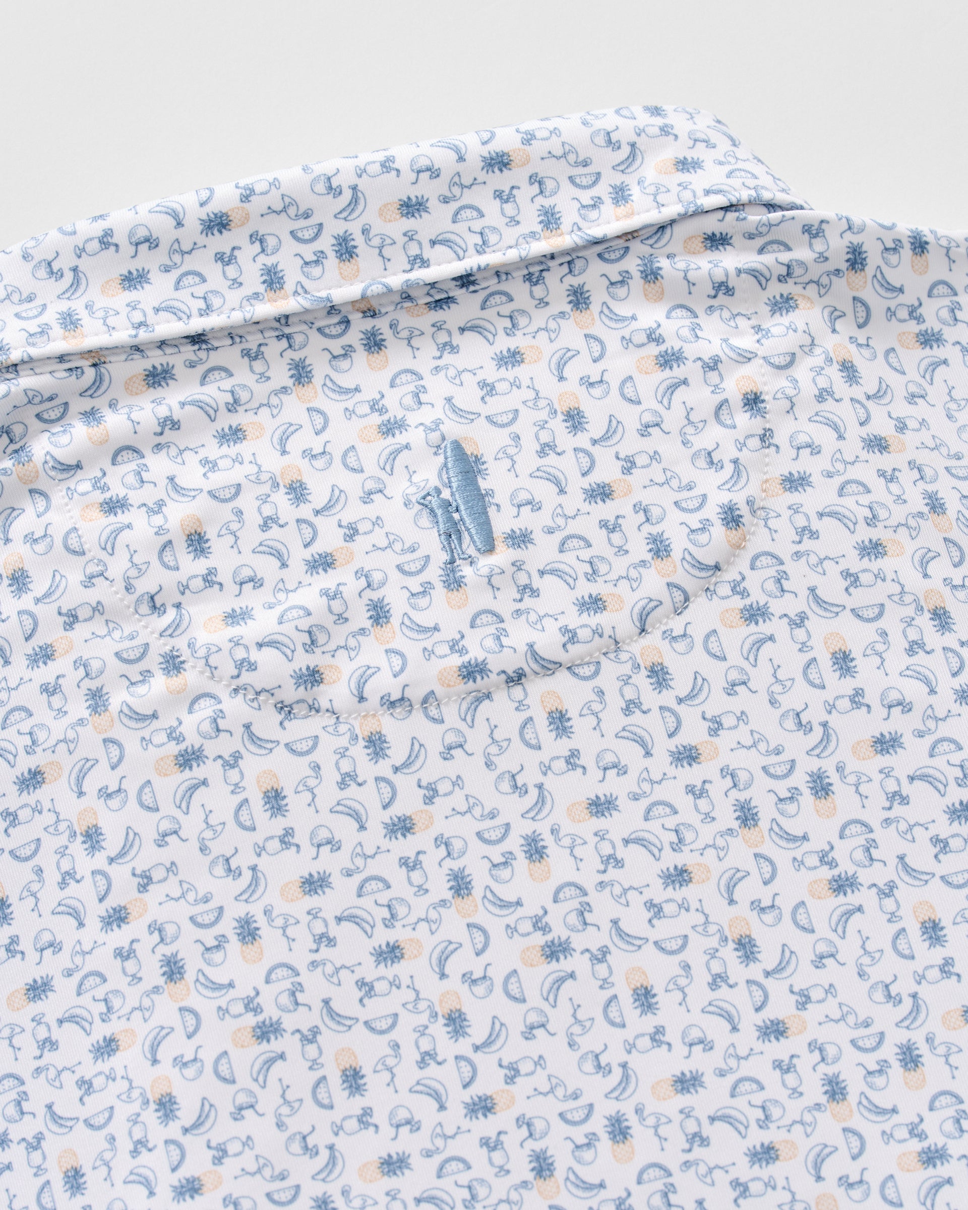 Johnnie-O Cabana Bar polo shirt in Carbon Fiber colorway with tropical fruit pattern