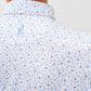 White Cabana Bar polo shirt with light blue and peach tropical print pattern