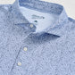 Johnnie-O Prawn Polo shirt in light blue with navy paisley pattern, showing collar and buttons