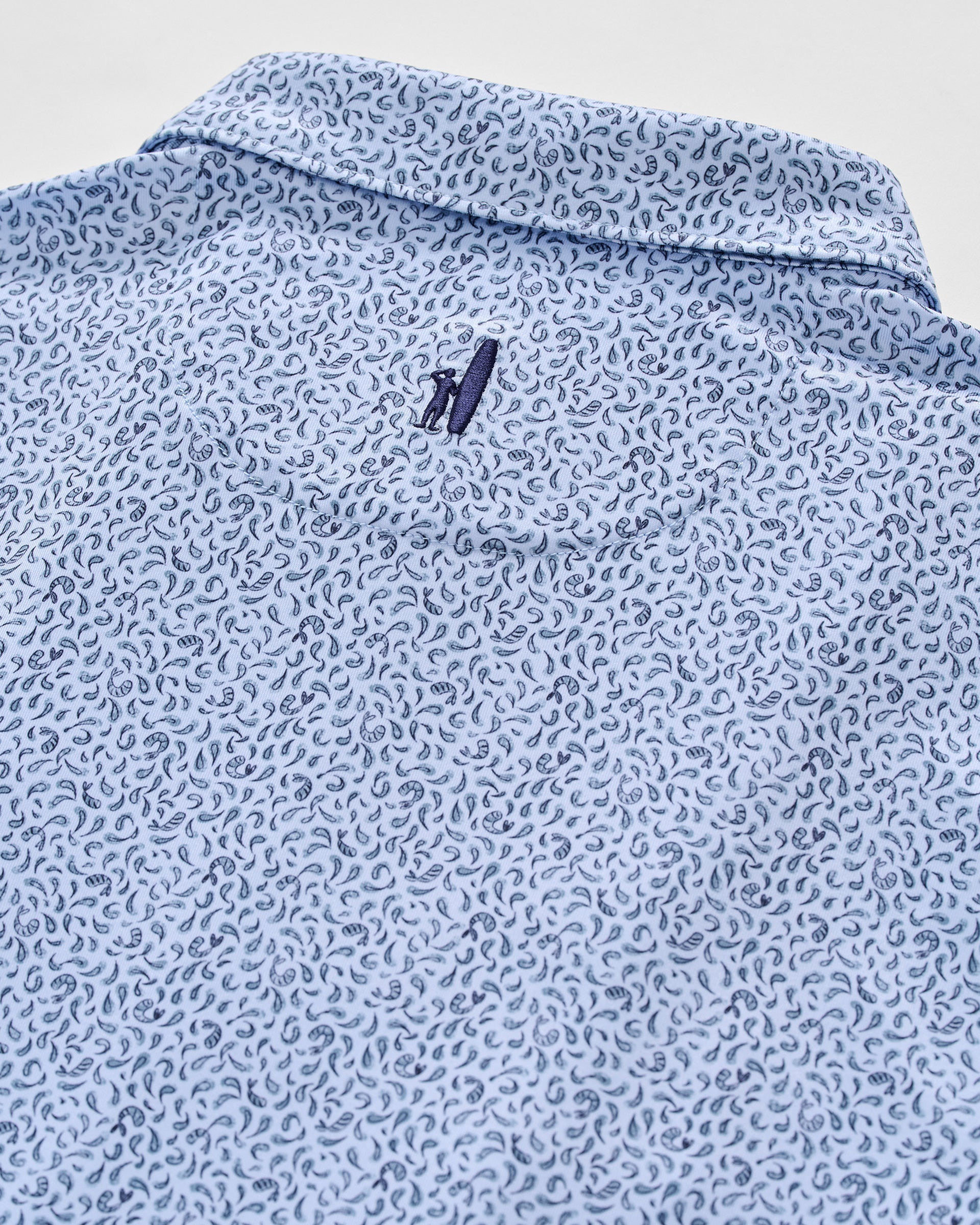 Johnnie-O Prawn Polo in Kona colorway featuring light blue base with navy paisley pattern
