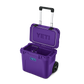 YETI Roadie 32 rolling cooler in Pace Purple with telescoping handle and wheels, open lid