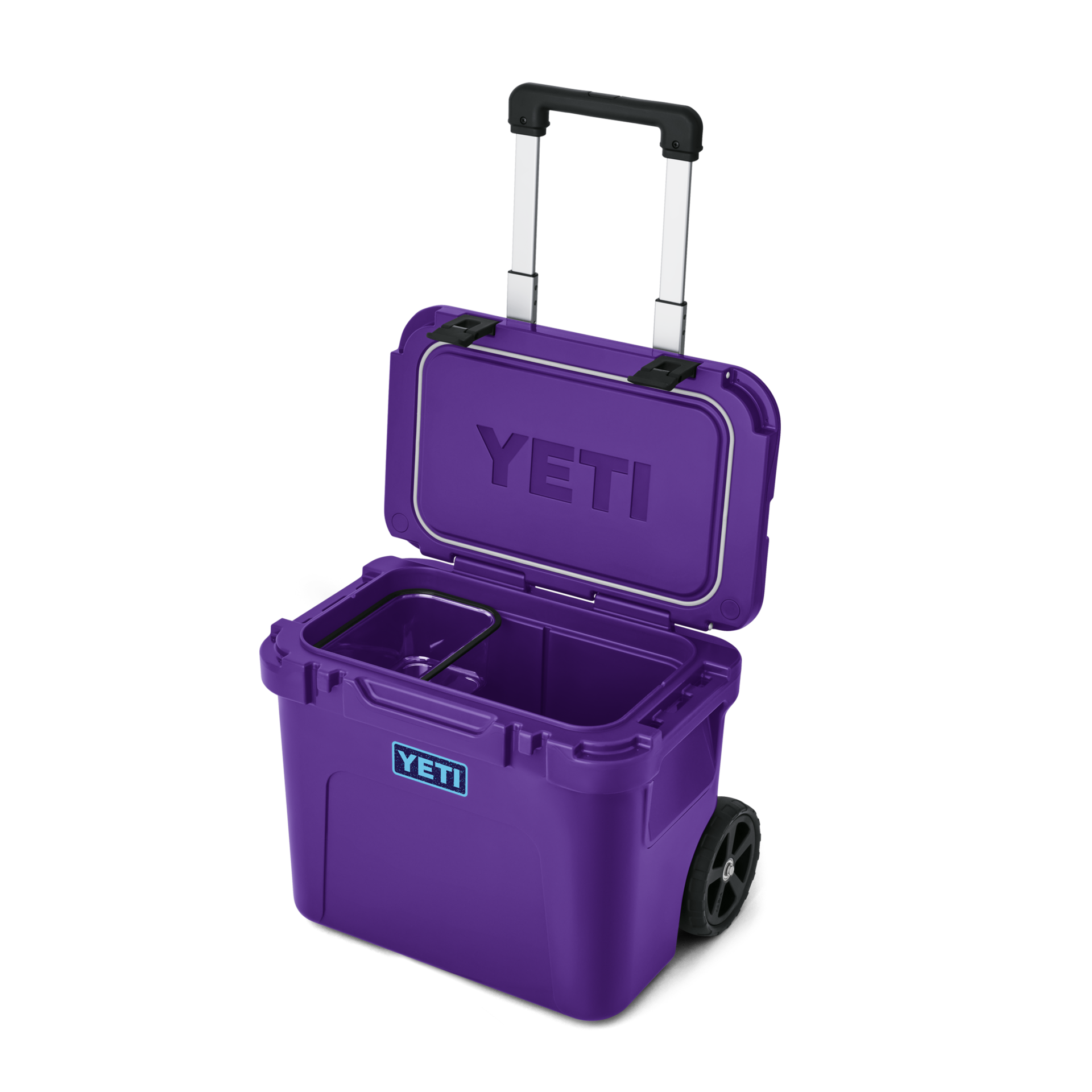 YETI Roadie 32 rolling cooler in Pace Purple with telescoping handle and wheels, open lid