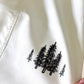 Grace in Motion Short in white with black pine tree graphic print detail on fabric